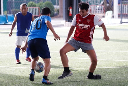 A player in an Arsenal shirt during a game five-a-side football in Bangkok
