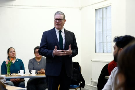 Keir Starmer talks during a visit to a community centre in London.