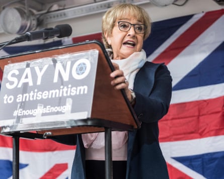 Hodge stands at the podium at a rally in Manchester in 2018.