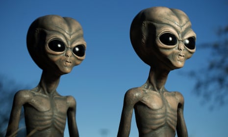 Two figures of aliens.