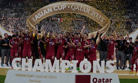 Qatar pose with the trophy after beating Jordan at the Lusail Stadium in the Asian Cup final
