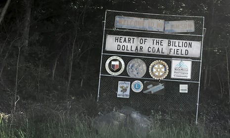 A faded sign welcomes drivers to Williamson, West Virginia.