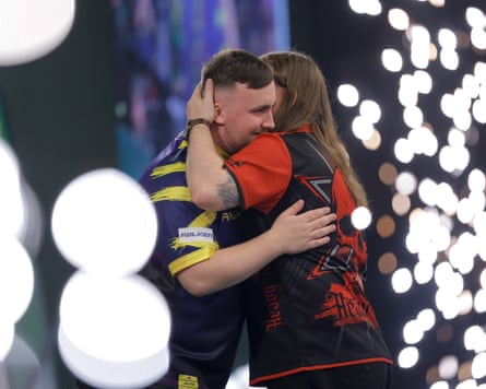 Luke Littler is congratulated by Ryan Searle after reaching his third straight world final.