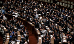 LDP MPs clap after the upper house of Japan’s parliament approved security bills clearing the way for a policy shift that could allow troops to fight overseas for the first time since 1945.