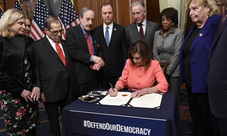 House speaker Nancy Pelosi signs the resolution to transmit the two articles of impeachment to the Senate for trial.