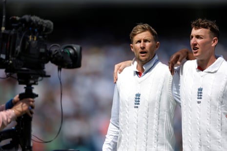 Joe Root and Harry Brook sing the National Anthem.