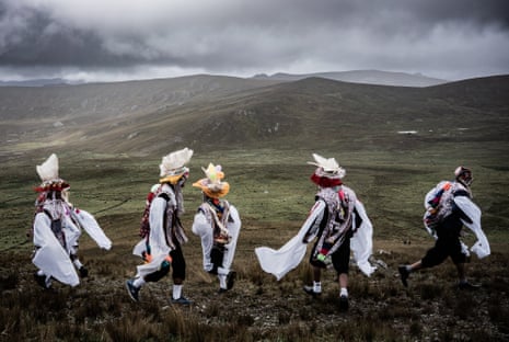 A group of men in traditional dress celebrate friendship and the bond with Pacha Mama, Mother Earth, during the Compadres festival in the Sacred Valley of the Incas