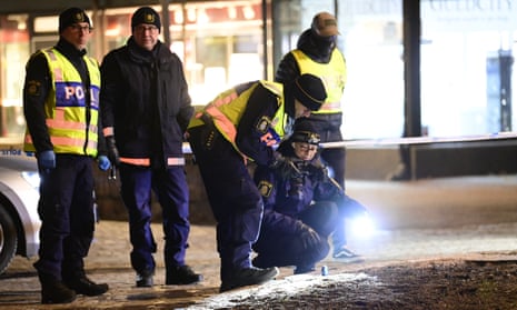 Police are seen in the area after several people were attacked in Vetlanda, Sweden, on 3 March. 