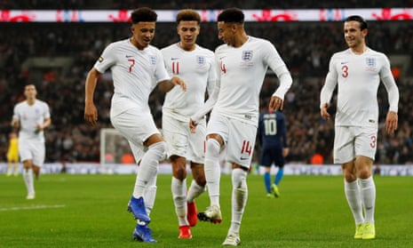 Jadon Sancho (left) and Jesse Lingard lead the celebrations after the Manchester United forward scored England’s opener against USA.