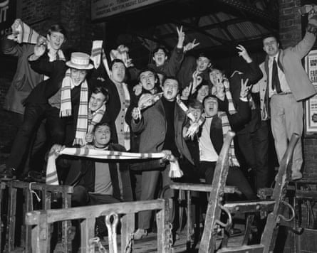 Leeds United football supporters waiting for a train in 1968.