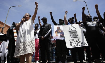 Melina Abdullah, left, of Black Lives Matter Los Angeles, leads a protest on 8 June.