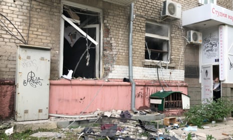 A damaged multi-storey apartment block following a blast in Luhansk.