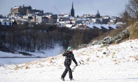 A person enjoys the snowy conditions in Edinburgh