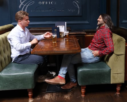 Hugo and William chat across a restaurant table
