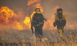 Firefighters with Cal Fire tackle spot fires near the town of Clearlake Oaks in northern California.