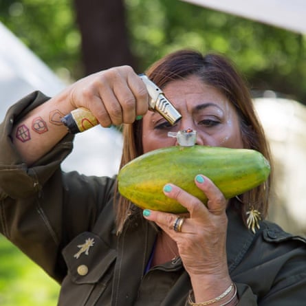 ‘Mama’ Sailene Ossman turning a papaya into a hash pipe.