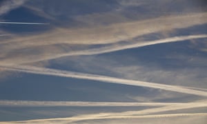 Contrails formed by passing aircraft.
