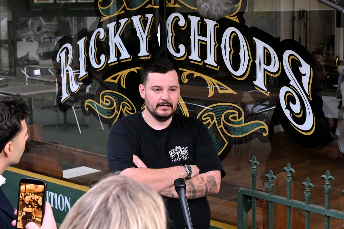 Barber Ricky Jefferies speaks to the media outside his Wangaratta barbershop, next door to Helen Haines’ constituency office.