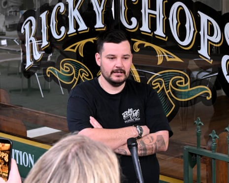 Rick Jefferies standing outside his barbershop, Ricky Chops.