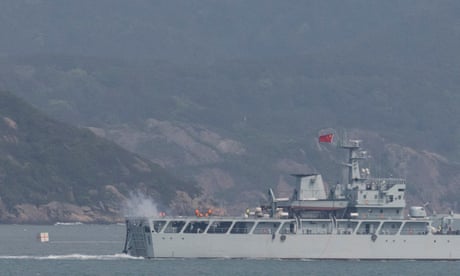 A Chinese warship fires towards the shore during a military drill near Fujian Province, close to the Taiwan-controlled Matsu Islands near the Chinese coast.