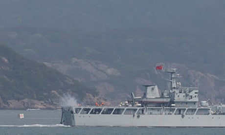 A Chinese warship fires towards the shore during a military drill near Fujian Province, close to the Taiwan-controlled Matsu Islands near the Chinese coast. 