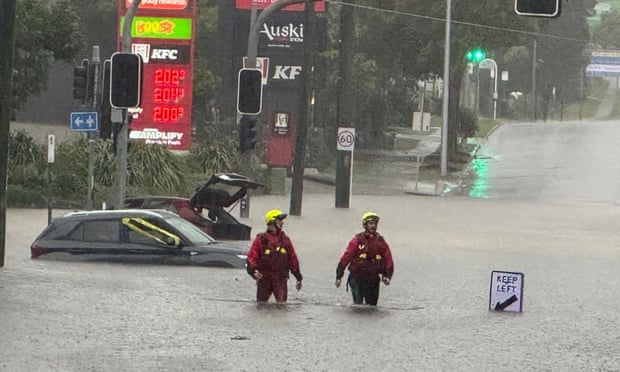 Australia Flood Evacuations: NSW, Queensland Under Threat After Ex-Tropical Cyclone Alfred Rescue being carried out on Monday on Newmarket Road in the Brisbane suburb of Windsor