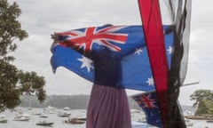 A woman displays an Australian flag on Australia Day