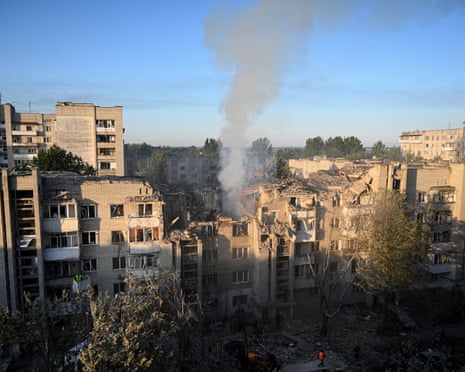 First responders operate at a residential building partially destroyed as a result of Russian missile strikes in the western Ukrainian city of Lviv.