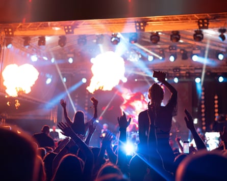 Silhouettes of an audience at a concert