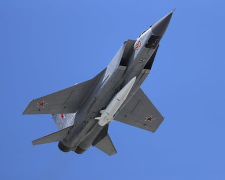 A jet plane flying against blue sky