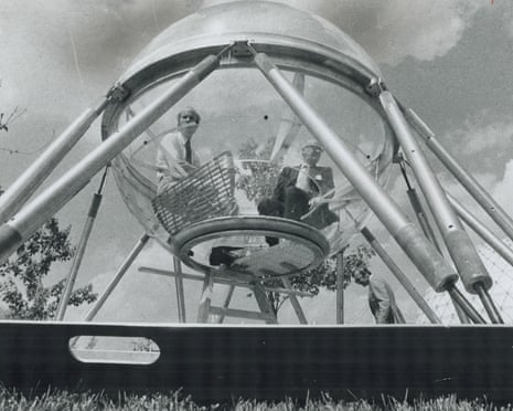 Black and white photograph of two white men in the Sub-Igloo pod out of water on a sunny day