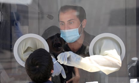 The medical team of Maccabi Health Services takes swab samples at a test station in Modi’in near Jerusalem, Israel.
