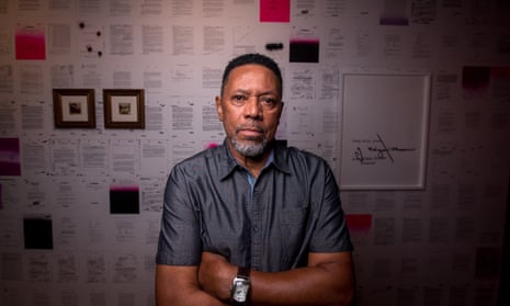 Rodney Barnette, who opened the Black Panthers’ Compton office, poses for a photo in front of an art exhibit about the group created by his daughter.