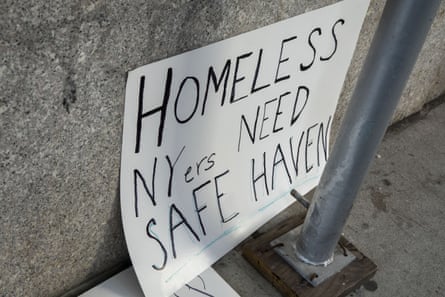 A homemade sign saying ‘Homeless NYers need safe haven’
