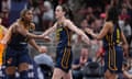 Caitlin Clark is congratulated by Aliyah Boston (7) and Kelsey Mitchell (0) during the second half of the team's loss to the Los Angeles Sparks