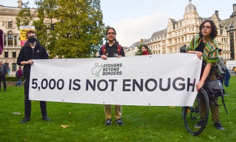 Protesters hold a banner saying ‘5000 is not enough’ at a rally supporting Afghan refugees in London last October.