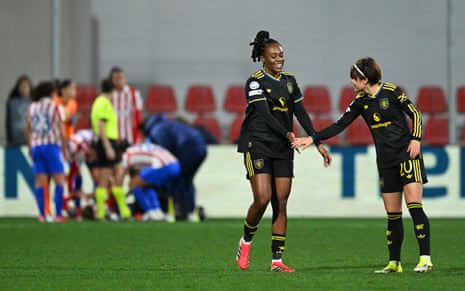 Melvine Malard celebrates scoring with Hinata Miyazawa.