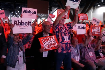 Audience members cheer as Greg Abbott speaks during his 25-minute address. Most of them are more concerned about the midterms than they are World Cup midfields