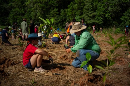 Local sugarcane farmer Clint Reynolds and his daughter attend the annual tree planting day on Night Wings property. ‘You have to have balance in the world and you have to put back a little bit that you take out.’