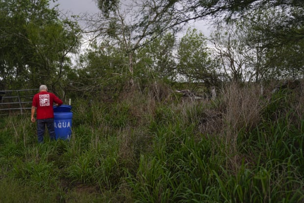 Migrant rights activist Eduardo Canales checks one of his blue water drops on 15 May 2021, in Falfurrias, Texas.