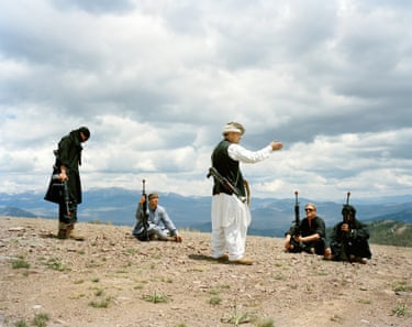 Marine major John Cowait playing the role of a warlord holding a Taliban training camp on a remote Afghan mountaintop, 2009 ‘Those portrayed in the photographs,’ says Beckett, ‘include military personnel – often veterans playing the role of enemy combatants, or immigrants from Iraq or Afghanistan. Local American civilians are hired to populate the artificial villages’