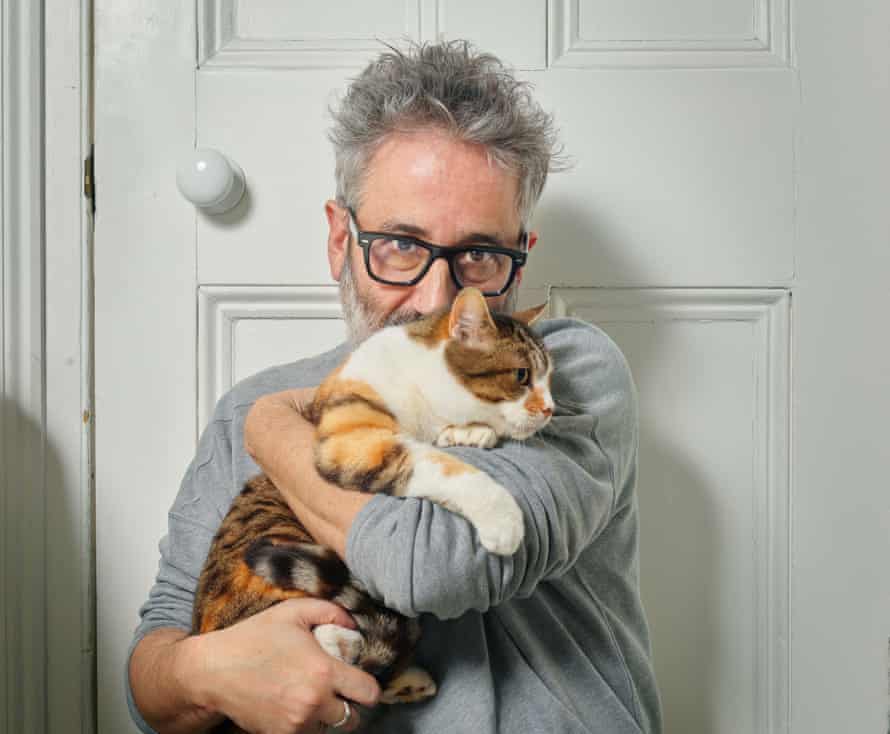 What’s up pussycat?: David with Zelda, one of his four cats.