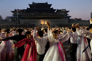 Students participate in a so-called mass dance on Kim Il-sung Square in central Pyongyang