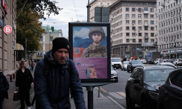 Poster with picture of a Russian soldier in the centre of Moscow.