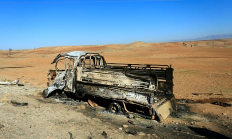 The remains of a vehicle after airstrikes Turkey said were carried out in Derik, Syria, on Sunday.