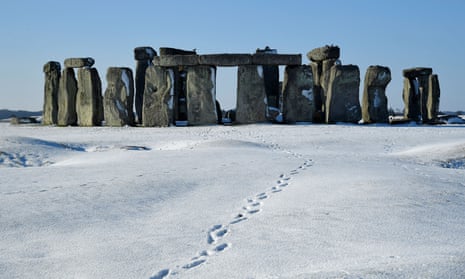 Stonehenge stone circle is seen in the snow