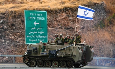 Israeli soldiers in an armoured personal carrier near the border with Lebanon