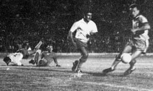 Costa Ricaâs Jorge âCutyâ Monge (white shirt) challenges the Brazil defender Airton while Guillermo âMemoâ Valenciano and the goalkeeper Irno try to regain their feet.