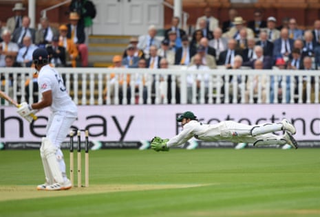 Mohammad Rizwan dives to take a catch