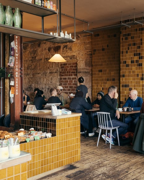 'Intensely likeable': Outlier, Glasgow.Diners sit at tables in Outlier café, Glasgow, with yellow tiled walls and a pastry counter.